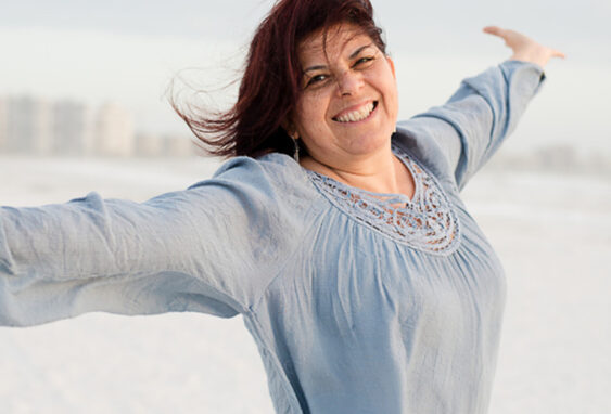 Woman smiling with open arms